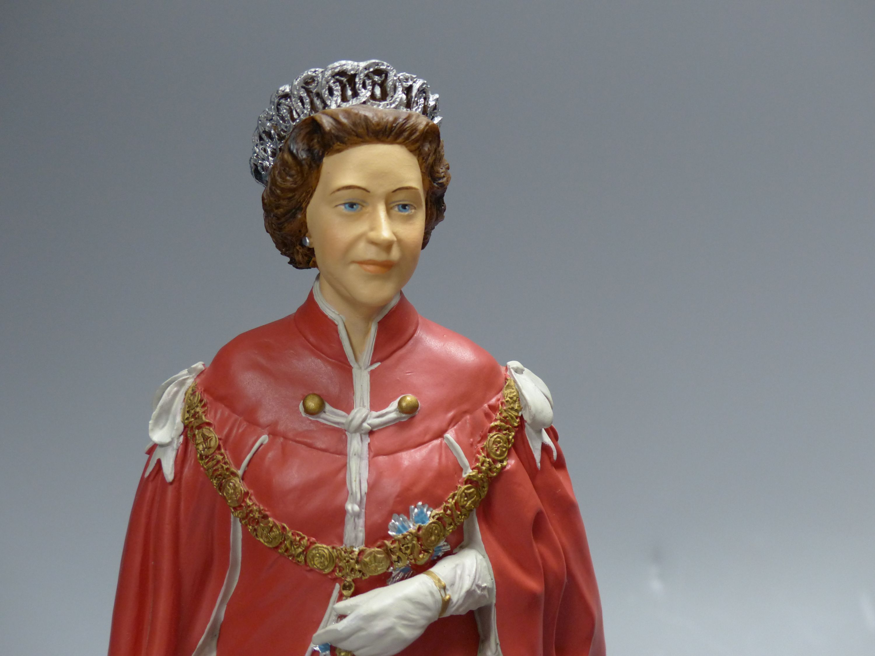Two cold-cast porcelain figures of HM Queen Elizabeth II by Timothy Potts, H 22cm